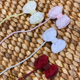 Prendedor de Chupetas - Romance